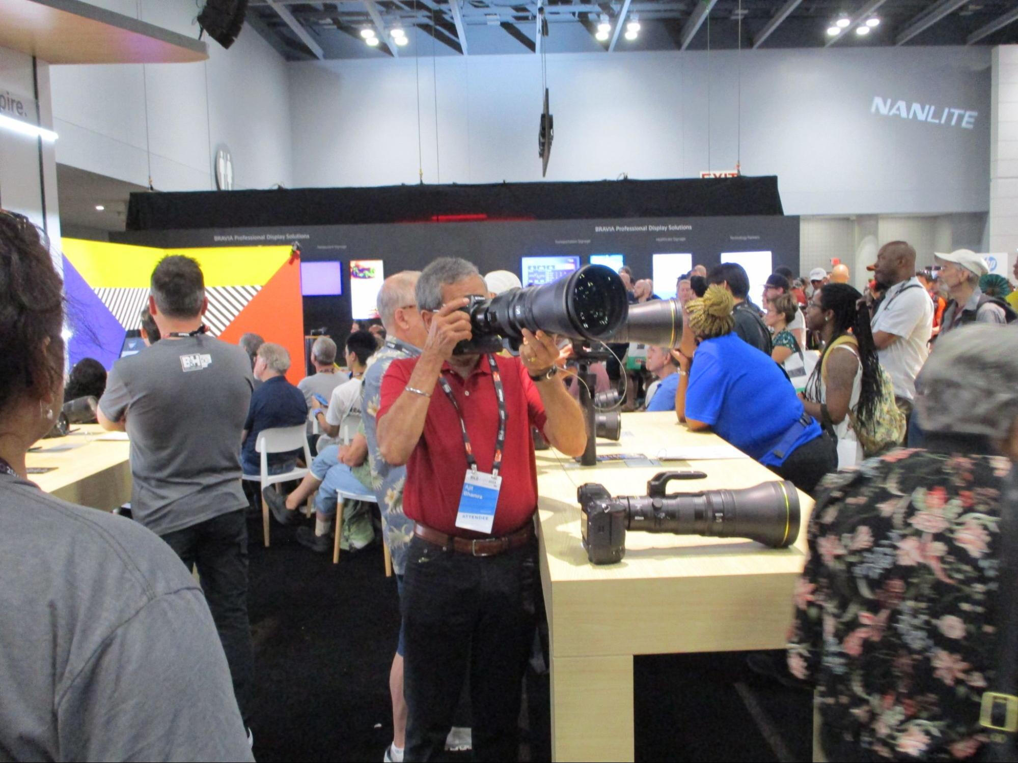 man with enormous camera